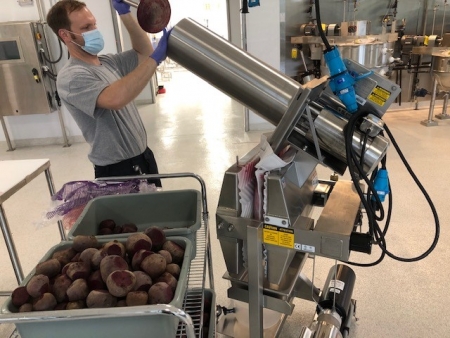 Pilot Plant Manager Joseph Hildebrand juices beets for a customer.
